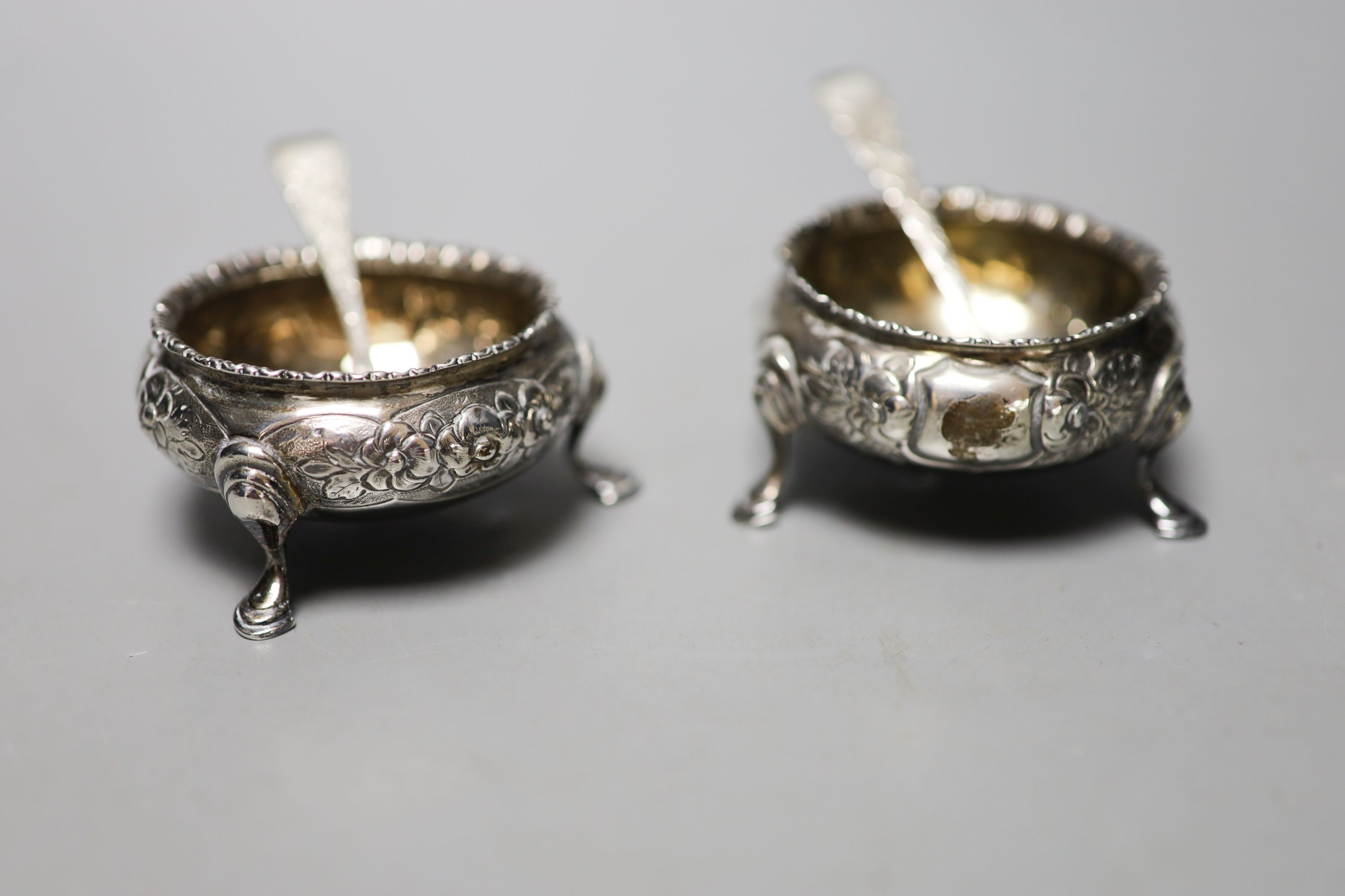 A pair of Victorian silver bun salts, London, 1859, two silver spoons, two mounted whisky tot jug (one a.f.), a silver cream jug, a silver napkin ring and a silver two handled pot and cover.